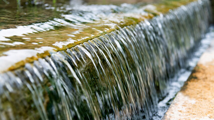 Water running down the stone step