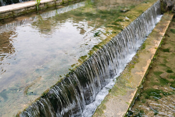 Water running down the stone step