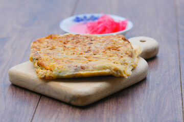 Malaysia muslim food Martabak or murtabak on wooden cutting board