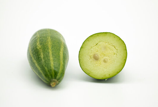 whole and slice pointed gourd potol on white background