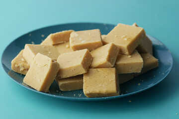 top view of indian sweet in a bowl on table.