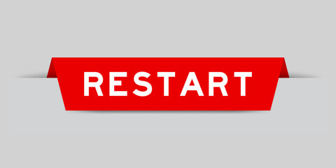 Red color inserted label with word restart on gray background - obrazy, fototapety, plakaty