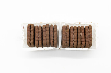coffee color biscuit isolated on white background, horizontal view, selective focus