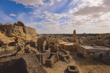 Panoramic View to the Sandstone Walls and Ancient Fortress of an Old Shali Mountain village in Siwa Oasis, Egypt - obrazy, fototapety, plakaty