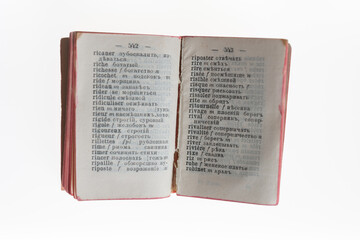 miniature Russian-French dictionary (focus point on cracked spine) 