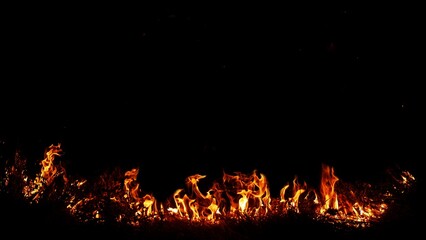 Haystack fires at night in arid areas The ash erupted and the wind was very dangerous. ashes red as hell.