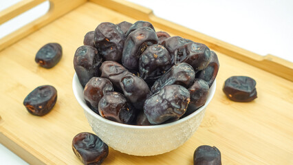 Dates also known as Khajur. Tasty dry dates isolated on white background. Arabic food that muslims eat during Ramadan. Super dietery food. 