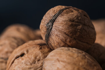 Walnuts on a dark background. Nutcracker close-up.