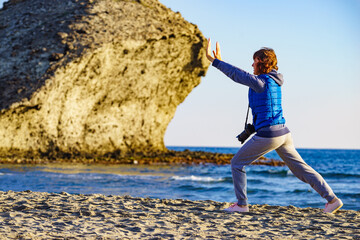 Woman walk on Monsul beach, Park Cabo de Gata, Spain