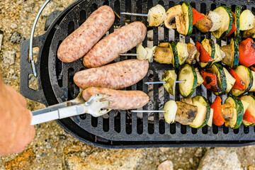 Grilled vegetables and meat on barbecue grill