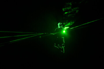 Neon man silhouette dark play laser show color light