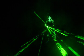 Neon man silhouette dark play laser show color light