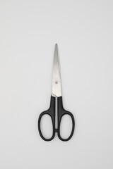 Black handled scissors isolated on white background