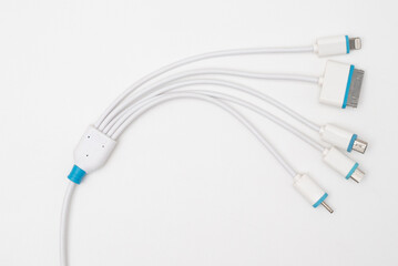 Five types of peripheral connections and a charging or data cable isolated on white background.