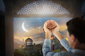 Ramadan Kareem greeting. Man praying.