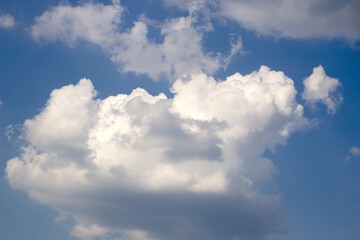 Naklejka na ściany i meble white clouds on a blue sky background