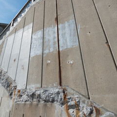 concrete wall with chiseled out detail and sky