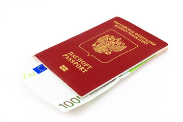 Russian passport with 100 euro banknote isolated on white background. Concept of currency restrictions for Russia, bribe or purchase of citizenship. Russian passport for travelling abroad