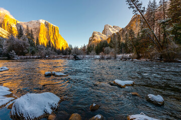 Yosemite National Park with winter snow and Merced River