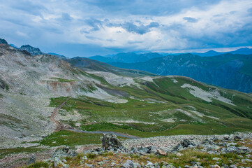 Mountain valley with snow peaks and clouds in Tetnuldi