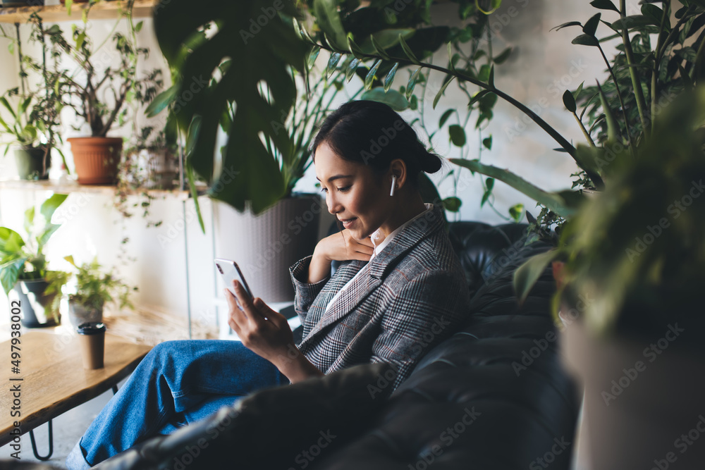 Poster millennial female blogger networking via mobile application browsing website with record podcast, as