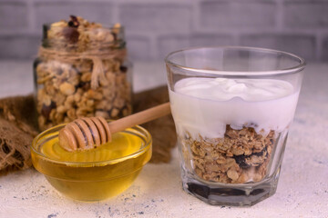 Greek yogurt dessert with granola and honey.