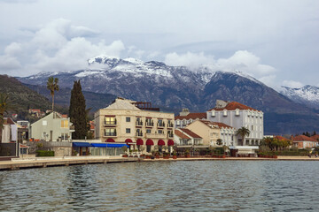 Fototapeta premium Overcast. Embankment of Tivat city on cold cloudy day. Montenegro, Adriatic Sea, Bay of Kotor