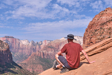 Fototapeta na wymiar Enjoying freedom in the Zion National Park. Panoramic View. Person in selected focus