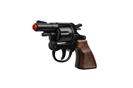 Toy gun revolver. Black pistol with brown handle. Isolate on white back