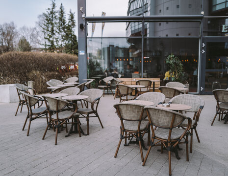 Tables and wooden chairs at outdoor restaurant