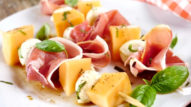 melon salad with prosciutto ham and mozzarella