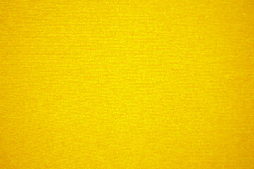 Yellow velvet fabric texture used as background. Empty yellow fabric background of soft and smooth...