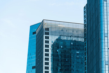 Fototapeta premium Modern office buildings under blue sky