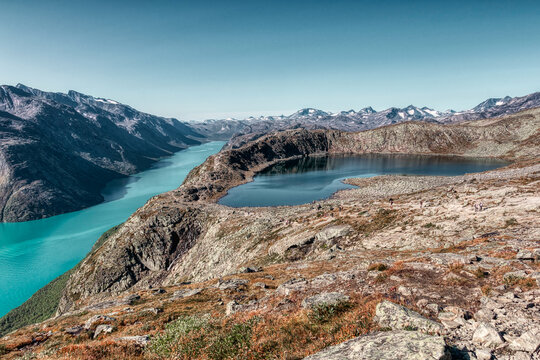 Famous Besseggen trail in Norway. Two azure lakes in the mointains. Epic trekking and view.