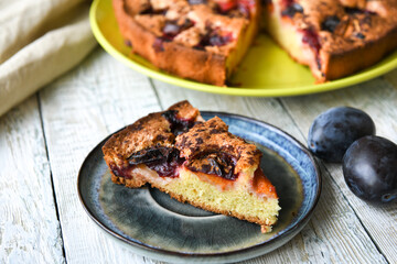 Piece of homemade plum cake with cinnamon.