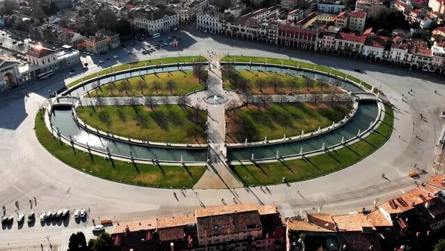 Aerial view of Padua in northern Italy. Drone view of Prato della Valle. A canal in the shape of an ellipse around the central part of the square. Bridges over the canal and a double row of statues
