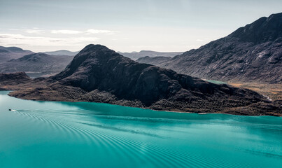 Norway trekking on mountains - Besseggen trail.  Epic view on azure Gjende Lake nad &Oslash;vre Leirungen.