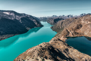 Famous Besseggen trail in Norway. Two azure lakes in the mointains. Epic trekking and view to Memurubu.