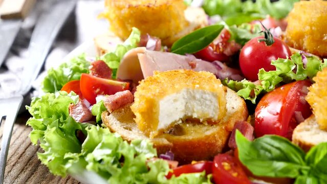 vegetable salad with bread toast and goat cheese
