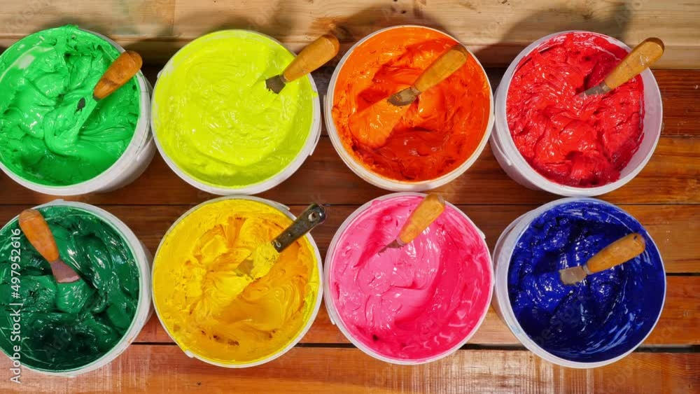 Aufkleber different colors are organized for t-shirt printing..the color of the ink lays neatly on the wooden 