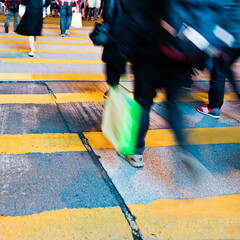 Busy people on zebra crossing street in Hong Kong