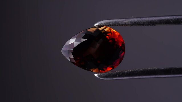 imperial champagne yellow topaz pear cut in the turning tweezers