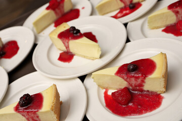 High Angle Full Frame Image of Plates of Cheesecake with Strawberry, Cherry and Blackberry Compote