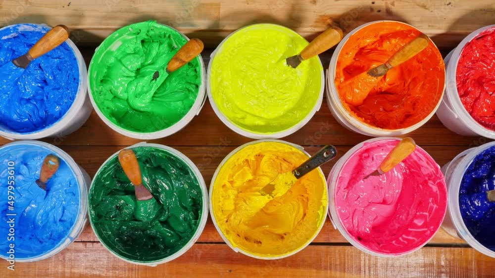 Aufkleber different colors are organized for t-shirt printing..the color of the ink lays neatly on the wooden 