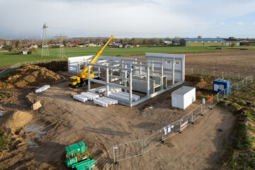 the basic structure of an industrial building is erected on a construction site
