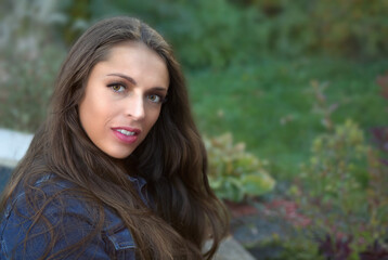 Fototapeta premium woman outside jean jacket twenty year old brunette in nature outdoor portrait lipstick girl smiling