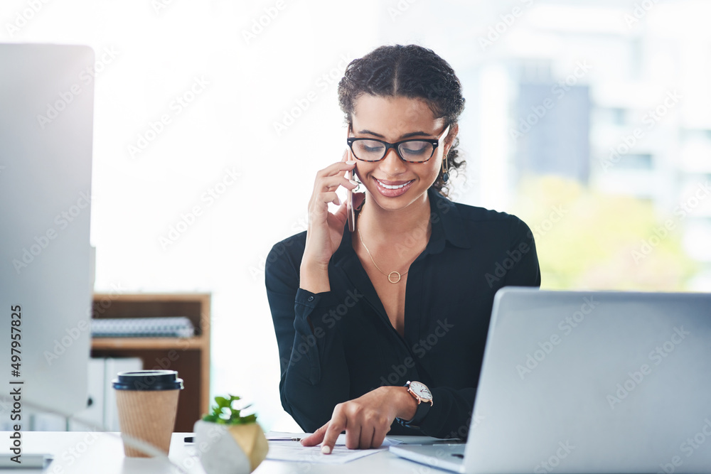 Poster calling up clients to keep them well informed. shot of a young businesswoman talking on a cellphone 