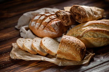 Bakery products on the kitchen rustic table. Various types of fresh fragrant crispy freshly baked...