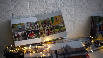Naklejka na ściany i meble travel photo books lie near the Christmas tree