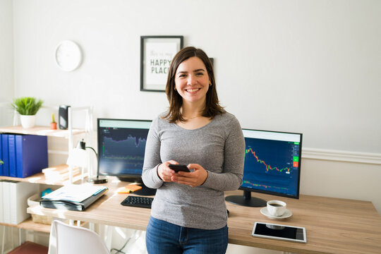 Excited woman checking the stock market